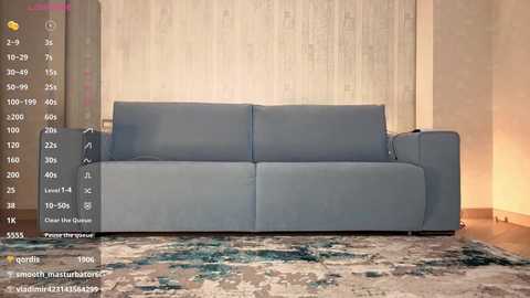 Video of a light blue couch in a modern living room with beige walls and a patterned rug. The image includes a digital overlay showing various room dimensions and furniture options.