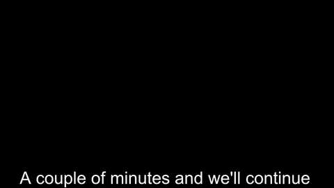 A plain black background with white text at the bottom stating, \"A couple of minutes and we'll continue.\" The text is centered and in a simple, sans-serif font.
