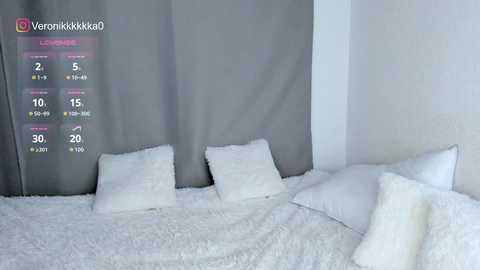 Video of a minimalist bedroom with a white bed, grey curtain, and white pillows and blankets. A social media post overlay displays a thermometer and temperature reading.