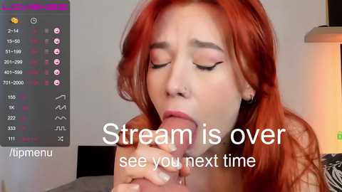 A video of a pale-skinned, red-haired woman performing oral sex on a man's erect penis, with a digital overlay displaying social media metrics and text saying \"Stream is over, see you next time.\